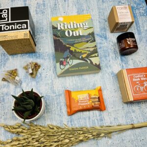 A picture of the selection of gifts for cyclists that are included in the Mindful Cyclist Gift Box.