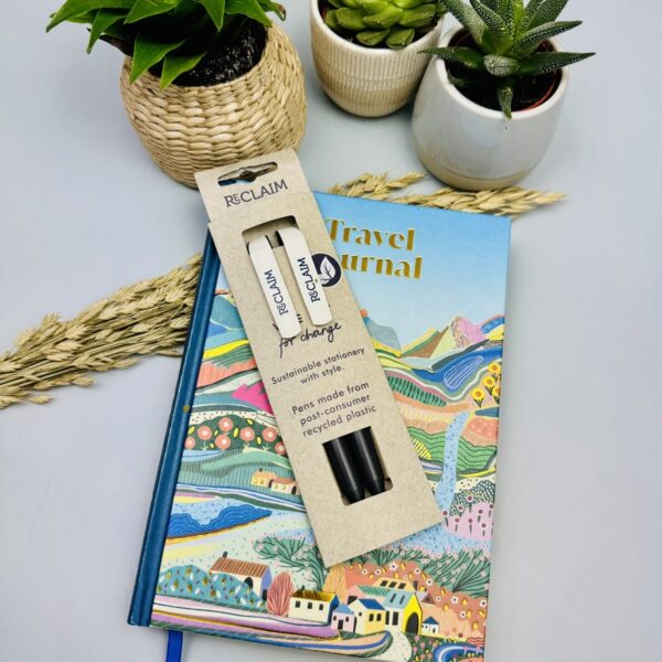A picture of the Vent Pens and DK Travel journal that are included in the Mindful Traveller Gift Box