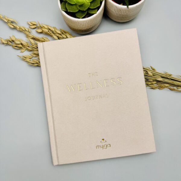 A picture of the Myga Wellness Journal that is included in the Run Well Gift Box